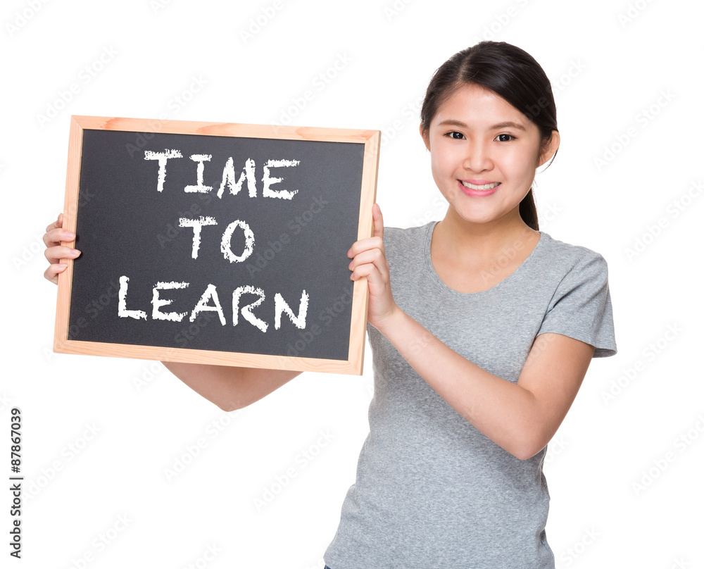Young student hold with black board showing phrase time to learn Young student hold with black board showing phrase time to learn