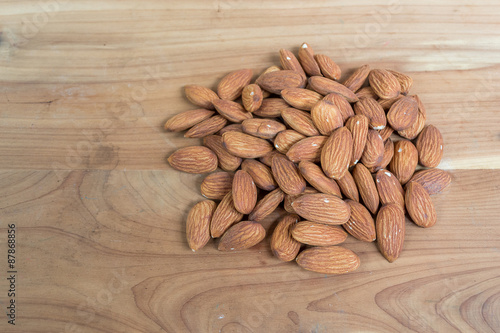 Almonds on wooden table