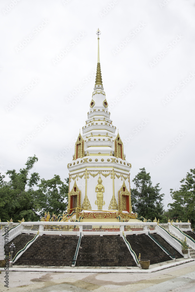 White pagoda and golden buddha.