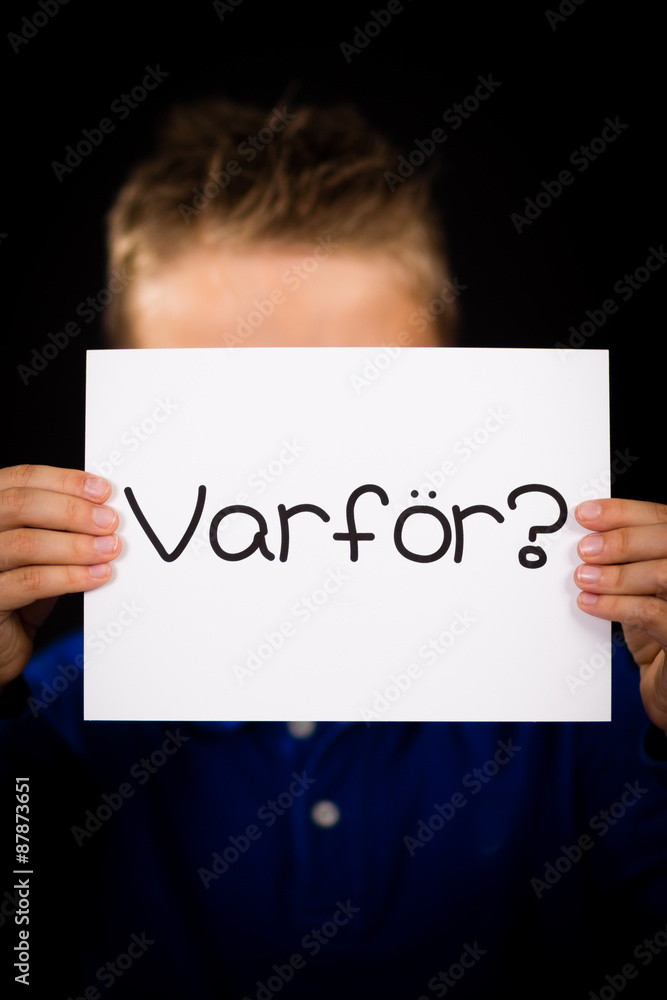 Child holding sign with Swedish word Varfor - Why Child holding sign with Swedish word Varfor - Why