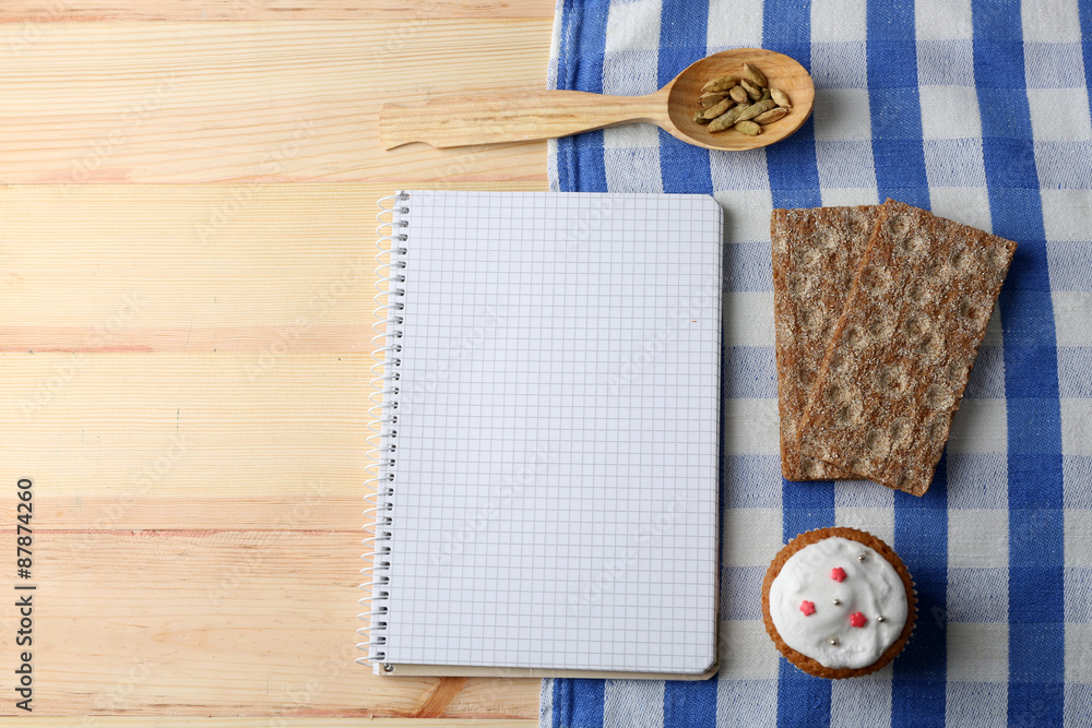 Open recipe book on wooden background Open recipe book on wooden background