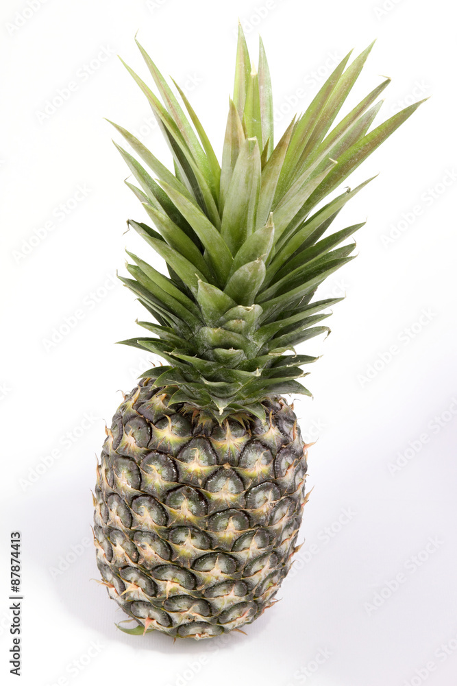 Green Pineapple isolated on white background, macro. Tropical fruit in Thailand. Green Pineapple isolated on white background, macro. Tropical fruit in Thailand.