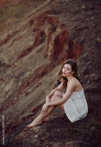 Portrait of an attractive girl on the sand