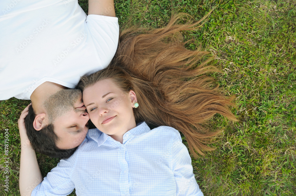 young couple in the park in summer time young couple in the park in summer time