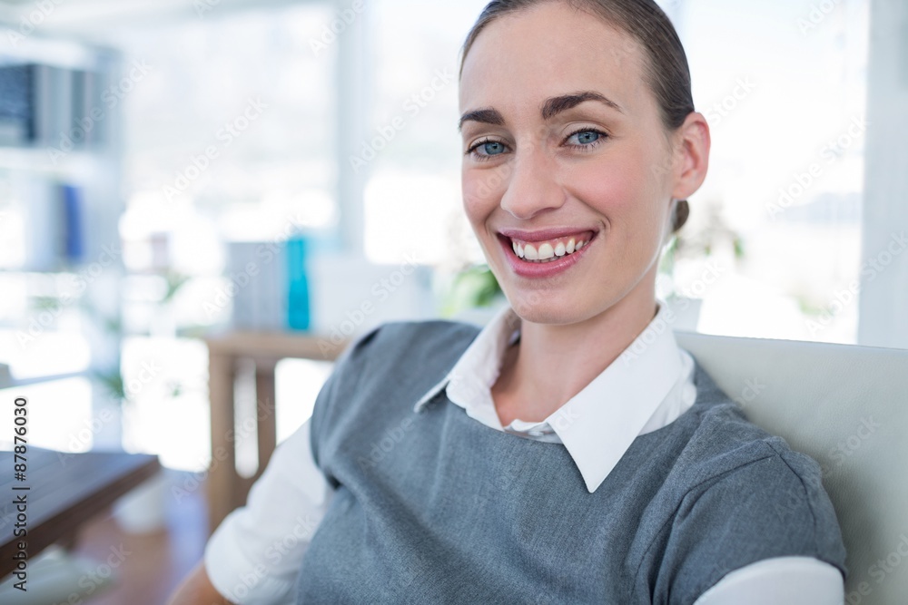 Happy businesswoman looking at camera Happy businesswoman looking at camera