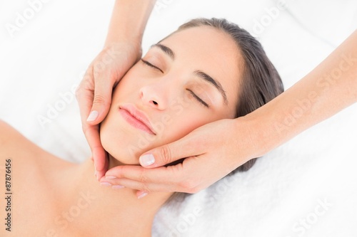 Attractive woman getting a head massage