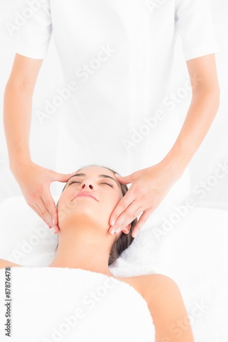 Attractive woman getting a head massage 