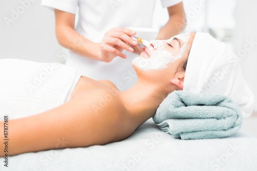 Attractive woman receiving treatment at spa center