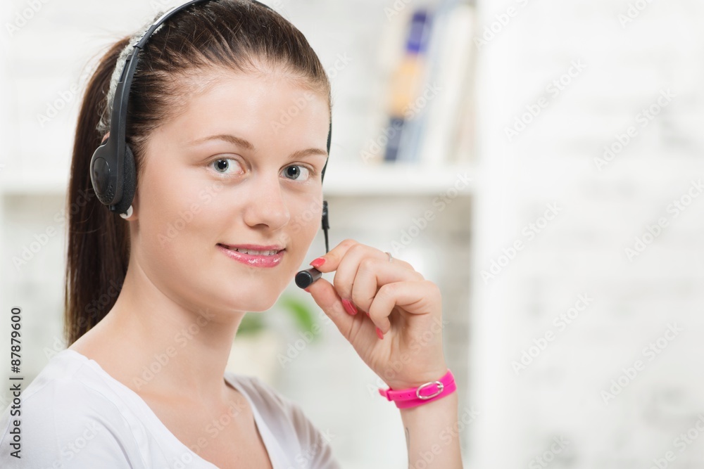Pretty young woman with a headset Pretty young woman with a headset