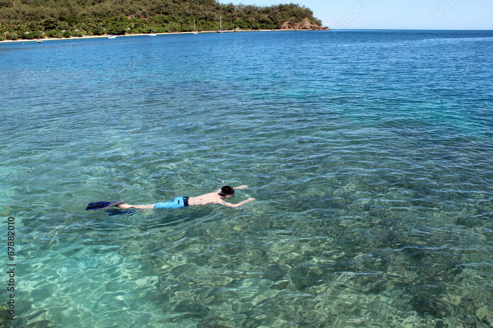 man snorkeling in Fiji
