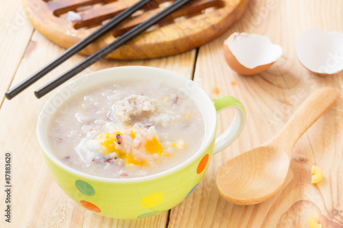 Traditional chinese brown rice gruel in white bowl, congee