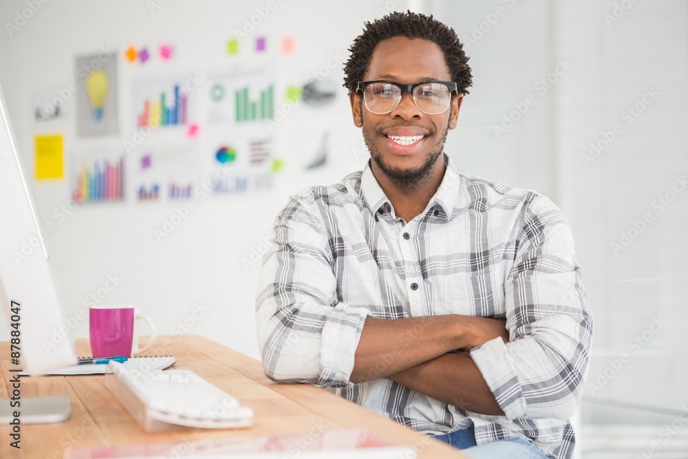 Fototapeta premium Young businessman smiling at the camera 