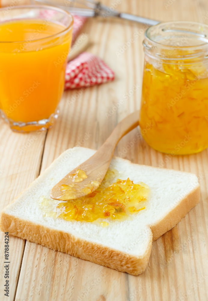 Breakfast with bread, jam and orange juice Breakfast with bread, jam and orange juice