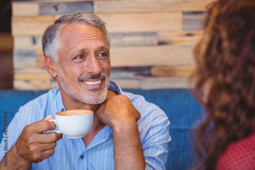  Cute couple having coffee together 