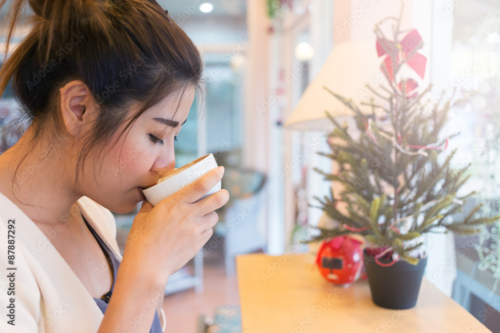 beautiful girl drinking hot coffee or tea in coffee cafe, model asia women beautiful girl drinking hot coffee or tea in coffee cafe, model asia women