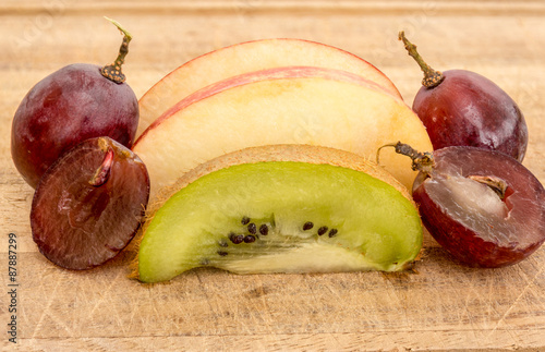 Close up macro image of Kiwi, Apple and Red Grapes Fruit photo