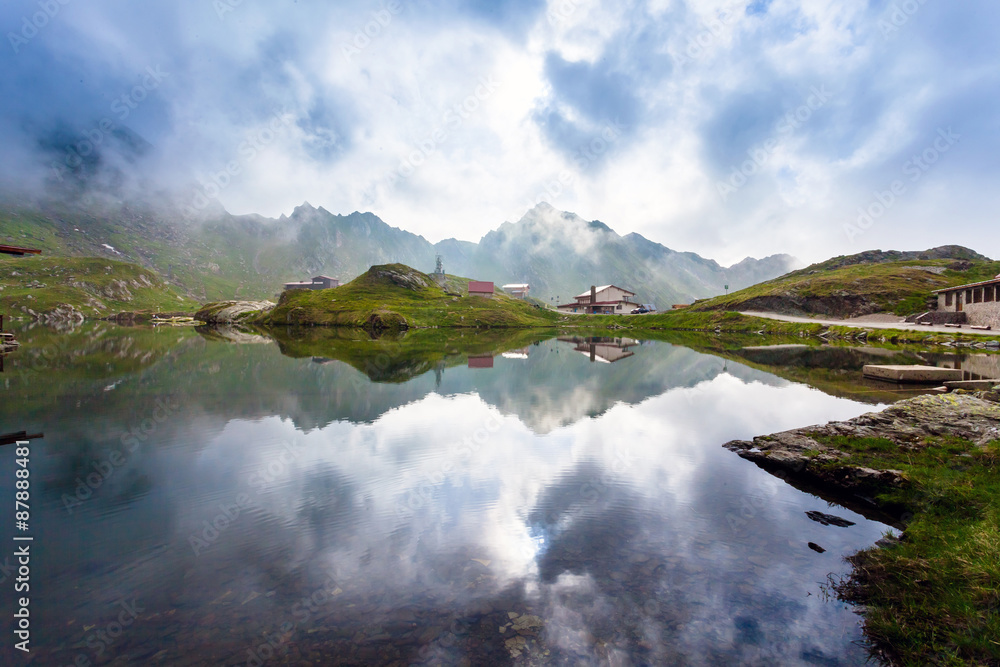 Idyllic view with typical lodges on Balea Lake shore in Fagaras Idyllic view with typical lodges on Balea Lake shore in Fagaras