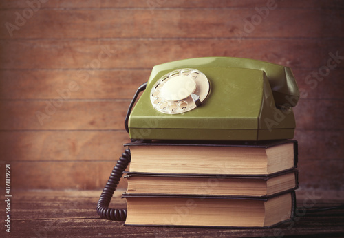 Dial phone over a books photo