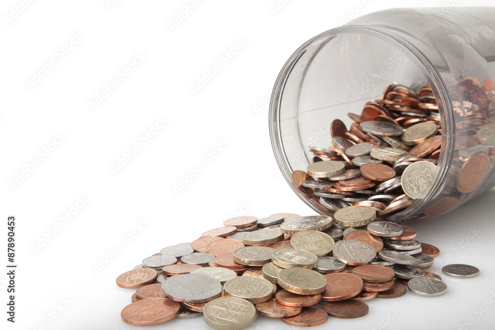 Money Jar full of bank of england coins,pound coins on top Money Jar full of bank of england coins,pound coins on top