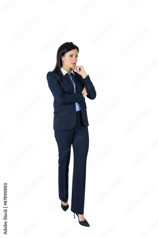 Brunette businesswoman thinking with hand on chin Brunette businesswoman thinking with hand on chin