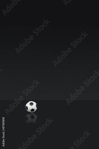 Black and white leather Football on a dark background
