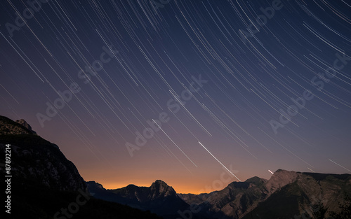 Startrails over the Apuan Alps at sunset, Tuscany, Italy