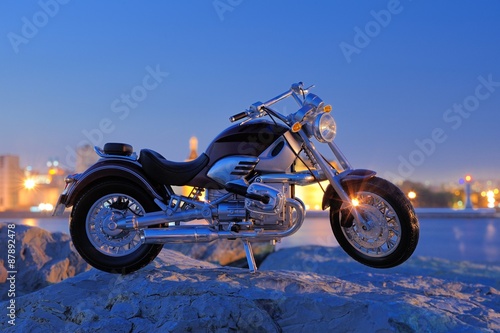 Motorcycle on the rocks in sunset and golden hours