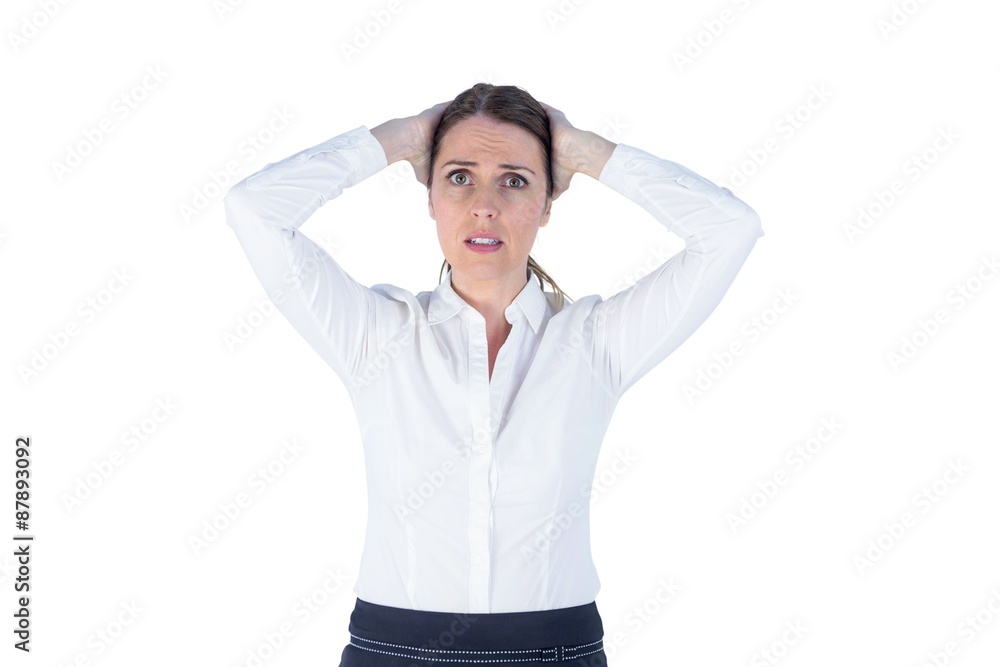 Stressed businesswoman with hands on her head Stressed businesswoman with hands on her head