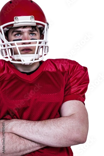American football player with arms crossed