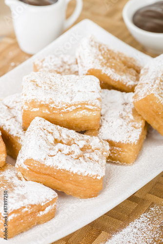 Yum Yum - Sweet toffee flavoured fried pastry dusted with icing sugar. 