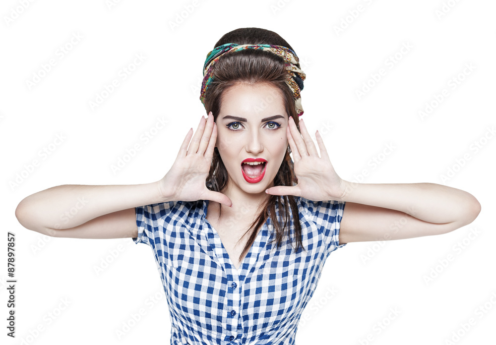 Young beautiful woman in retro pin up style shouting with her ha Young beautiful woman in retro pin up style shouting with her ha
