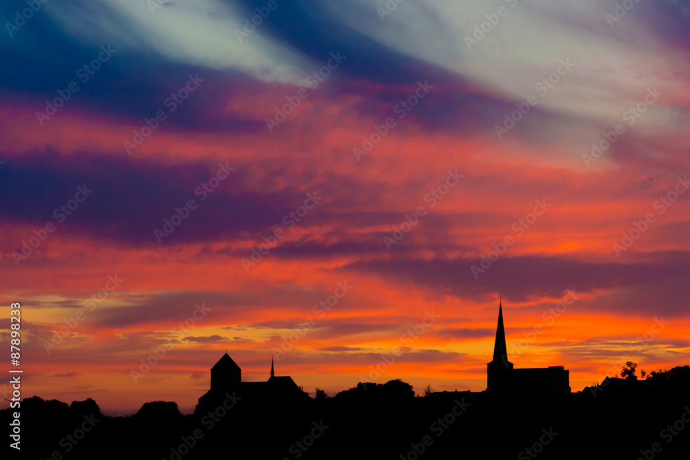 Obraz premium church on a orange sky. Church against sunset