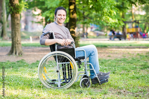 Portrait of a smiling man on a wheelchair