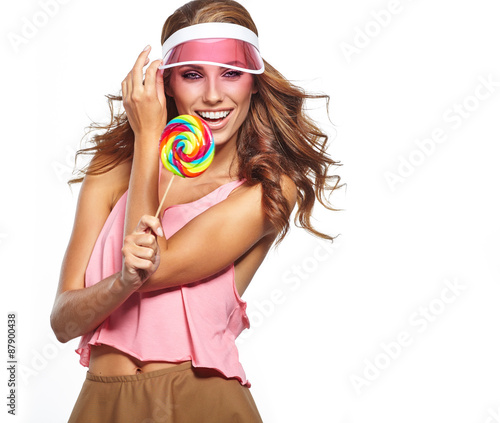 Bright makeup. Beauty Girl Portrait holding Colorful lollipop. P