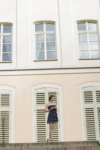 elegant woman near old building