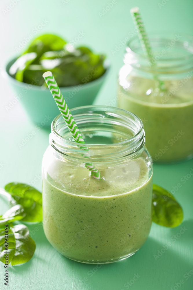 healthy green smoothie with spinach mango banana in glass jars healthy green smoothie with spinach mango banana in glass jars