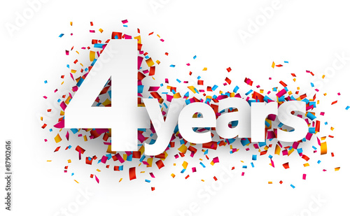 Four years paper confetti sign.
