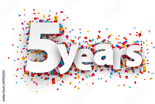 Five years paper confetti sign.