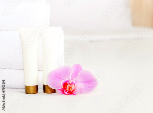 set of cosmetic bottles on a white background with space for text