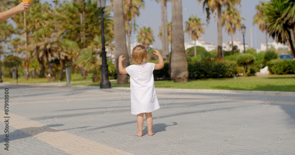 Small Girl Chasing Air Bubbles Small Girl Chasing Air Bubbles