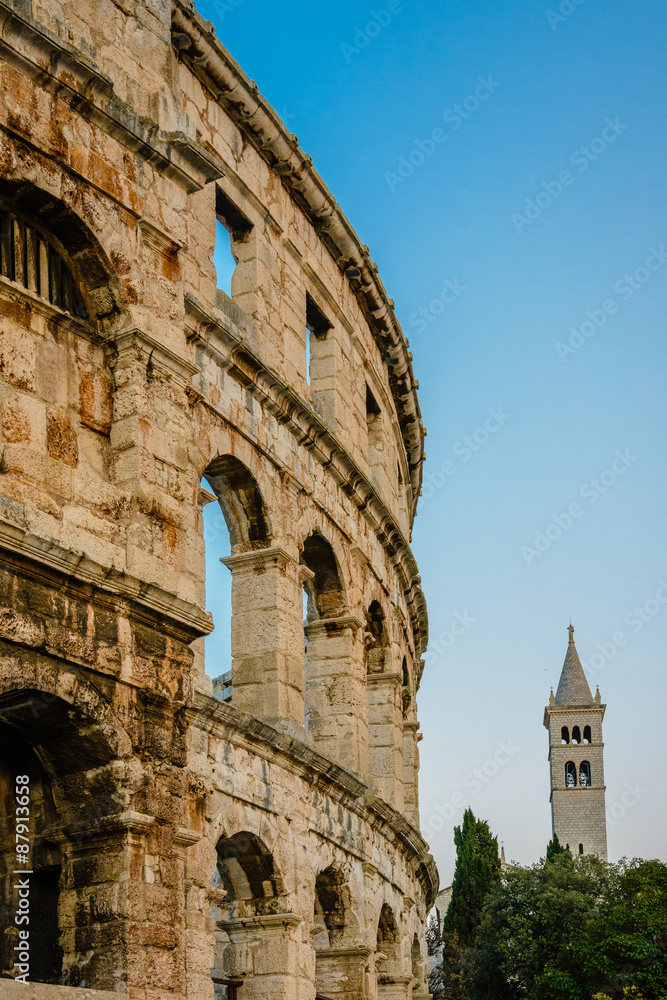 Arenamauer mit Kirchturm arena in pula croatia which is similar to the colosseum in rome