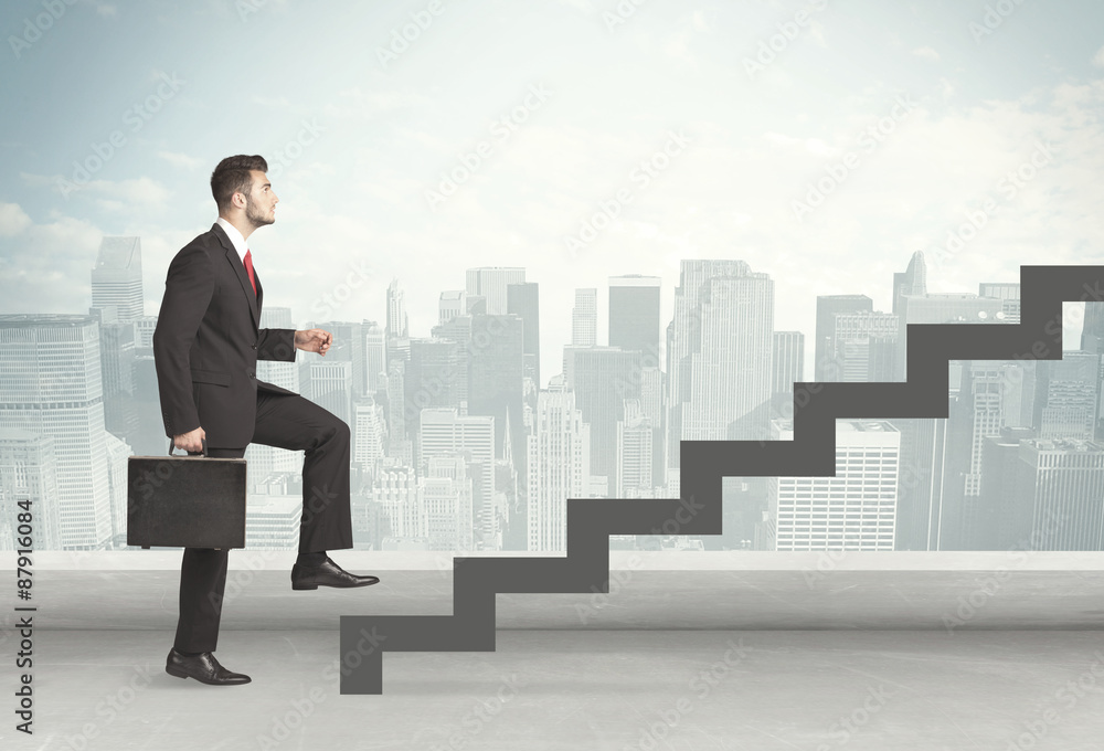Business person in front of a staircase Business person in front of a staircase
