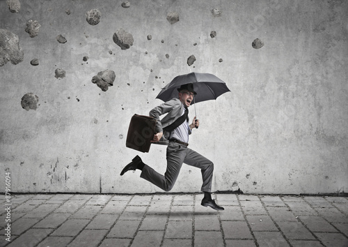 Quadro em tela Manager running from a rain of stones