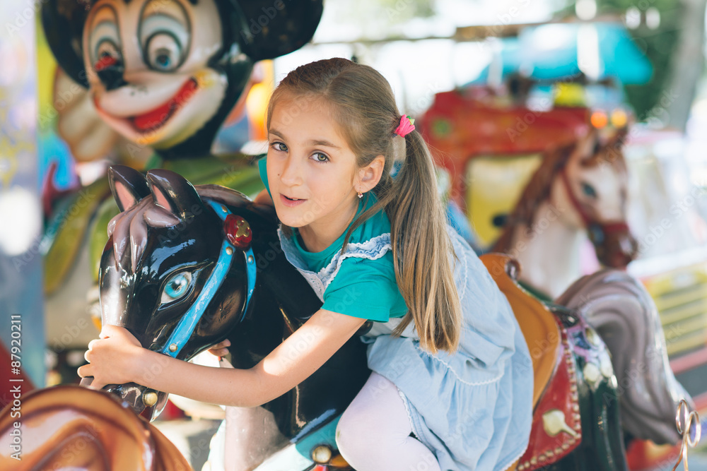 Little girl in amusement park.