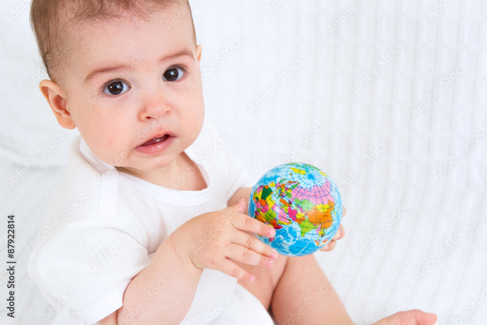 Baby and globe. Isolated on white background Baby and globe. Isolated on white background