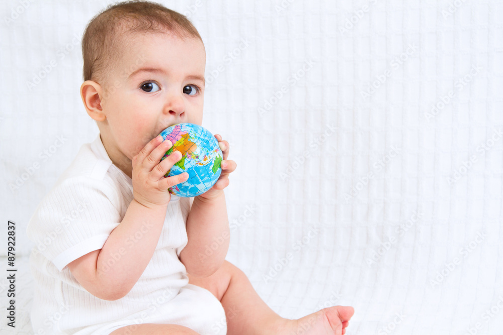 Baby and globe. Isolated on white background Baby and globe. Isolated on white background