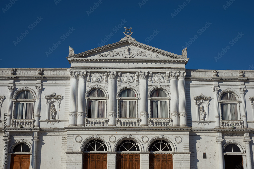 White classical style theatre in Plaza Arturo Prat in the old quarter of Iquique on the Pacific coast of northern Chile.