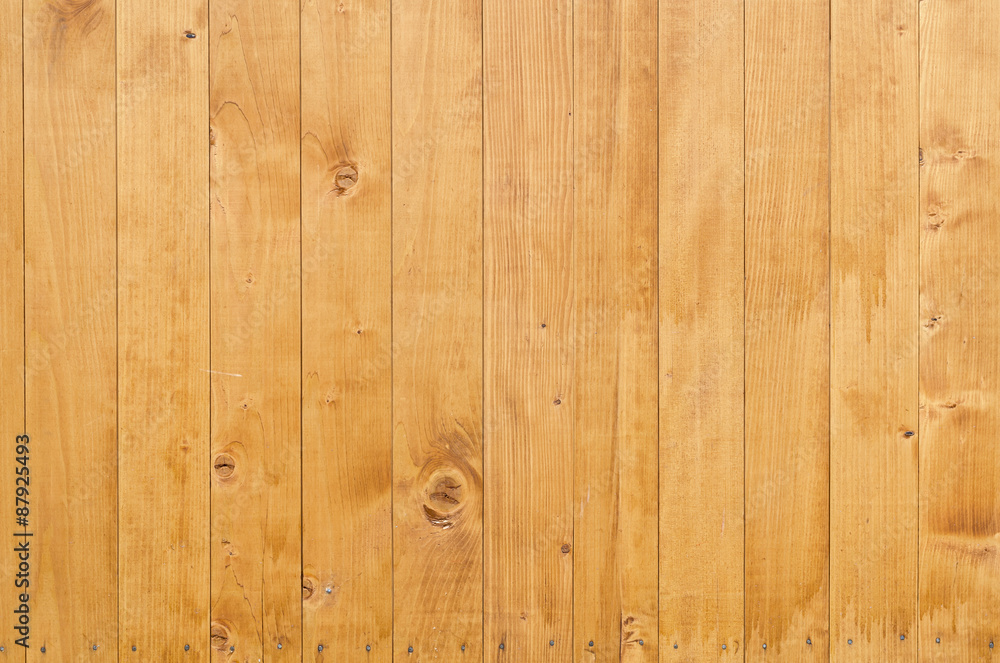 Naklejka premium Yellow background wooden texture for design