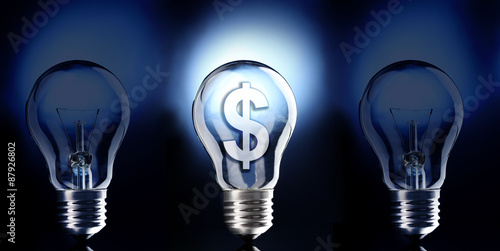 Light bulb with Dollar symbol on dark background