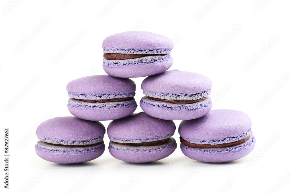 Fototapeta premium Tasty purple macarons isolated on white